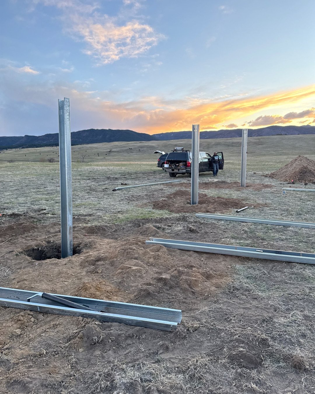 Ground-mount solar piers at sunset